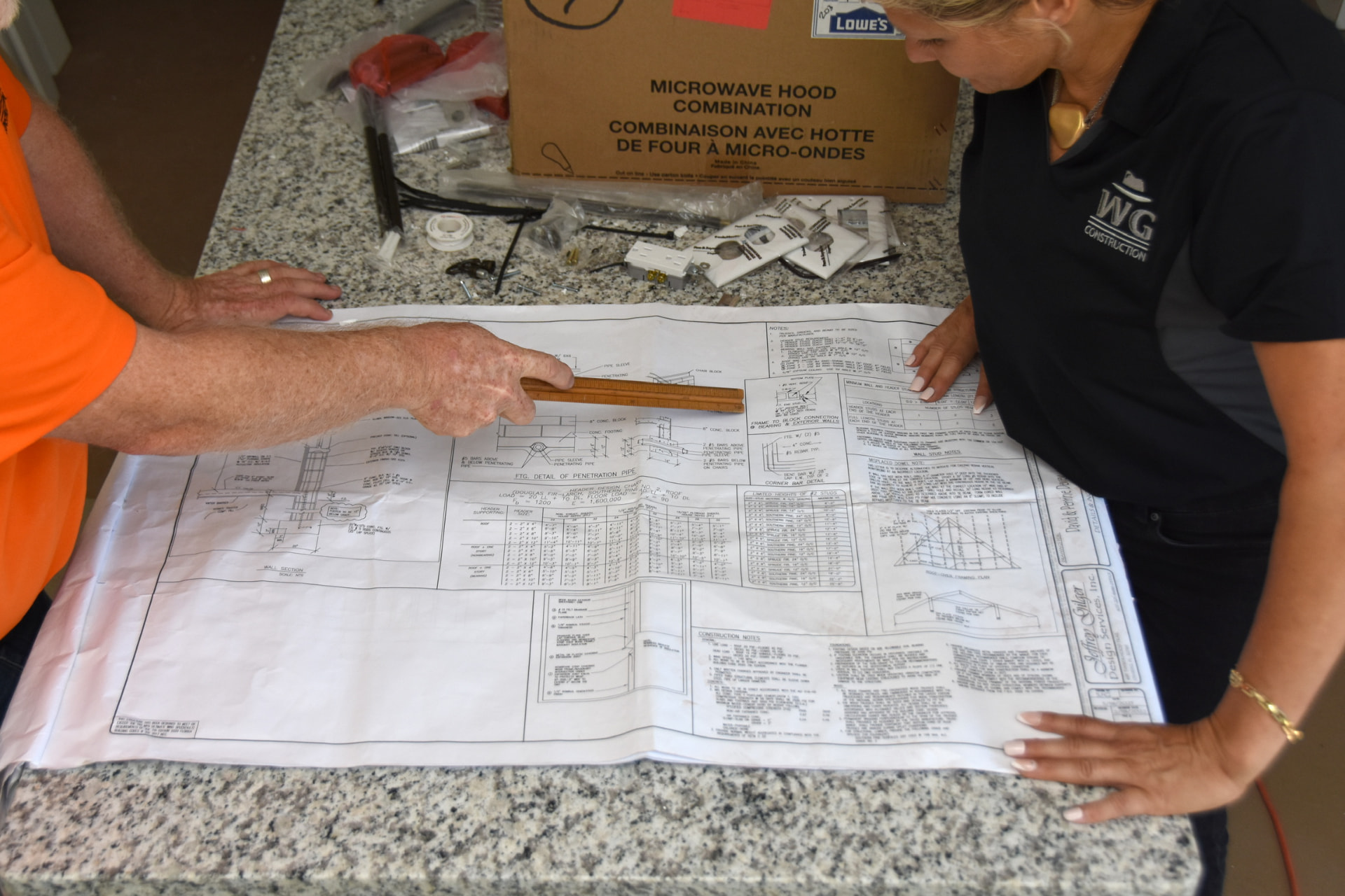 Kurt and Lana Gies reviewing residential plans and finish samples