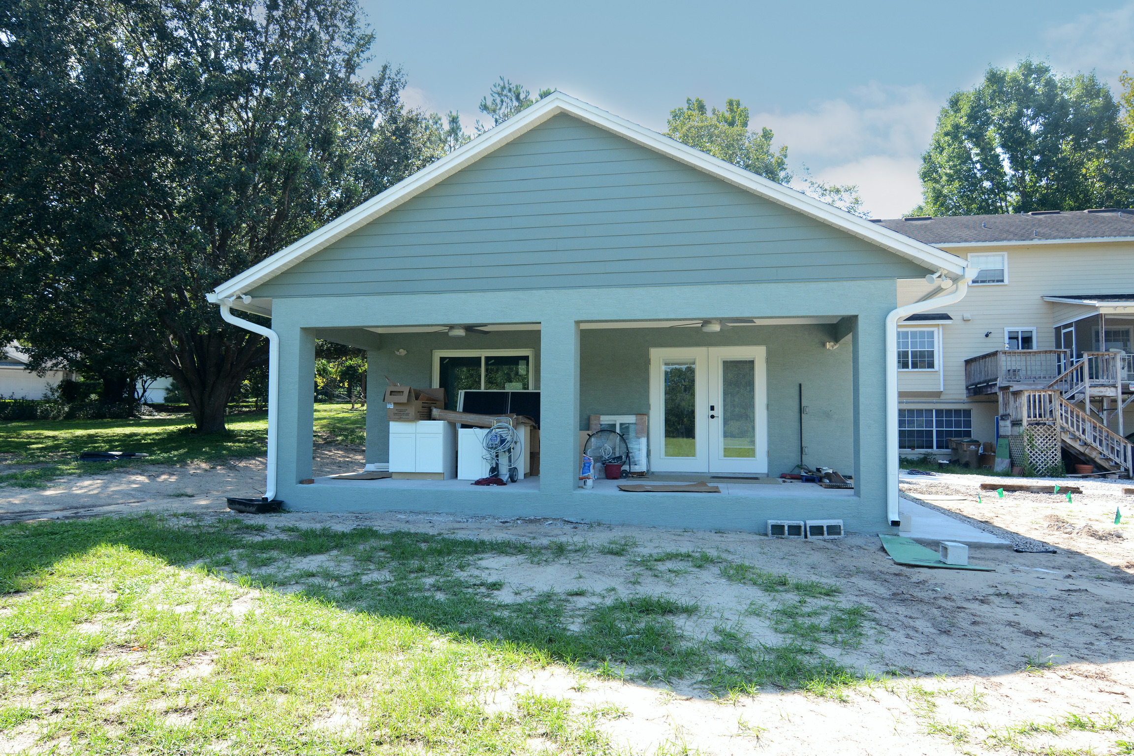 Completed cottage exterior with a rebuilt covered porch