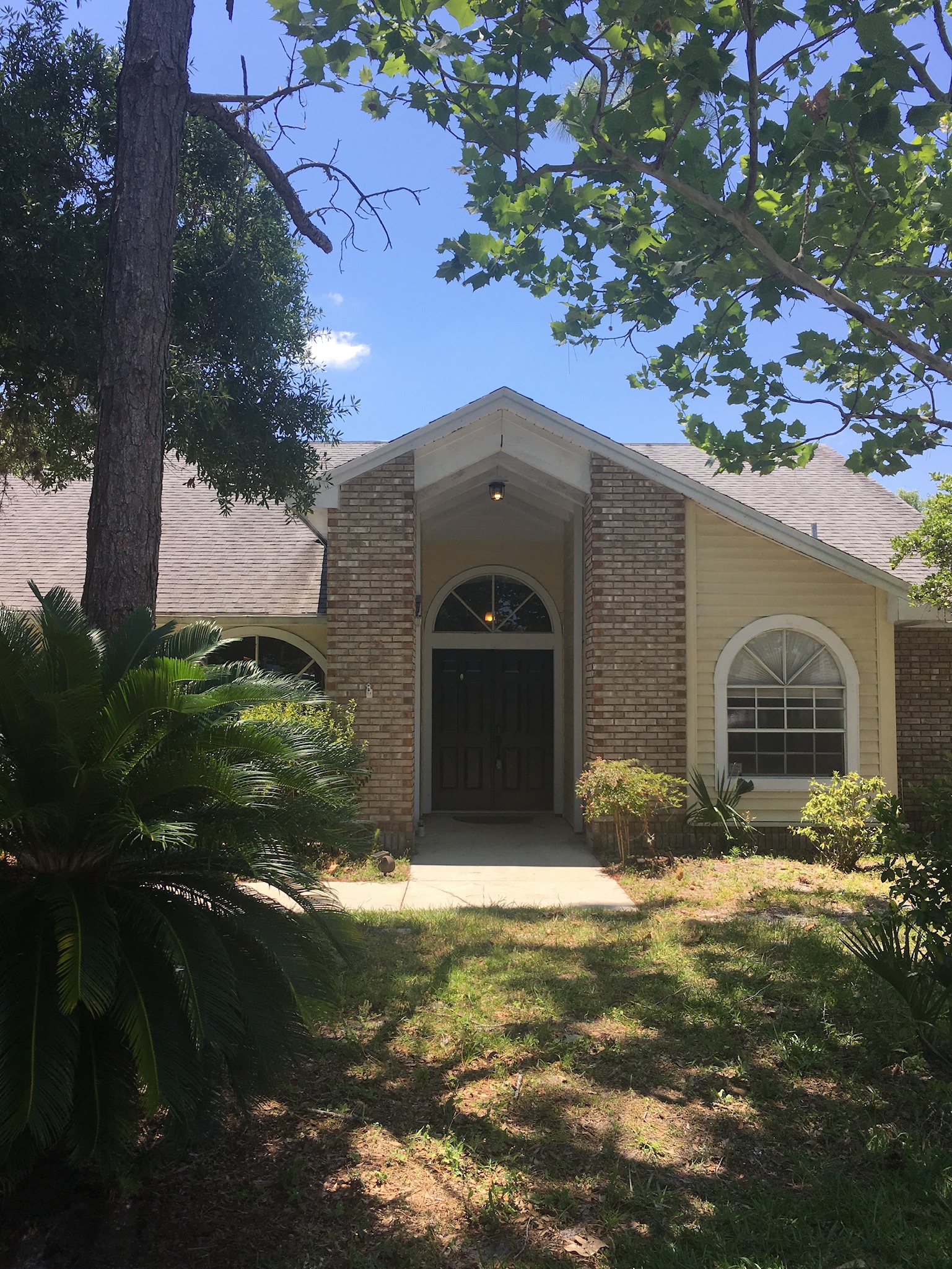 Front elevation of a Central Florida brick home renovated by Wise Gies Construction