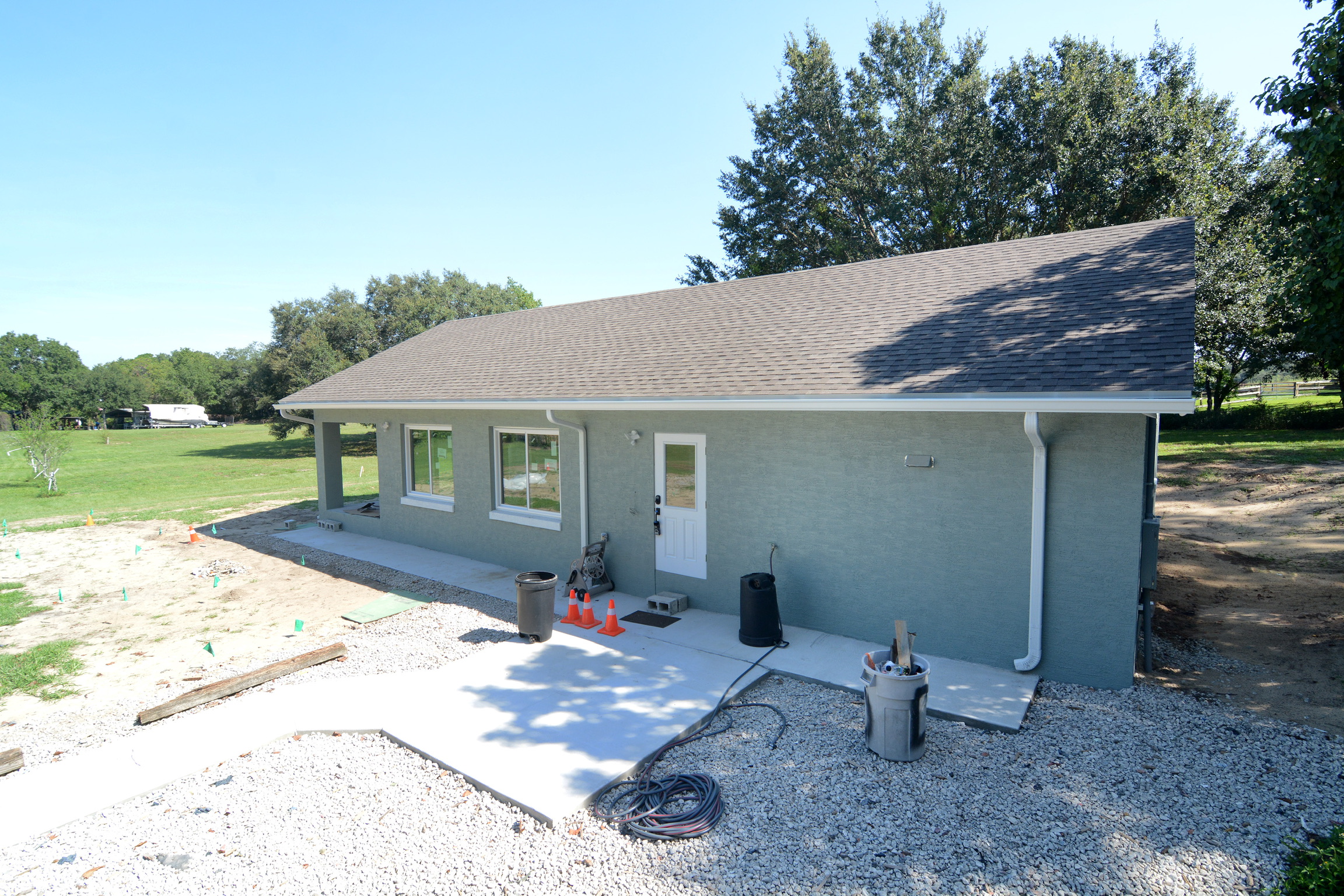 New porch structure framed on a blue Central Florida home